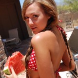 Country girl Craving Carmen makes a mess with her juicy watermelon in a tiny checkered string bikini and tiny jean shorts